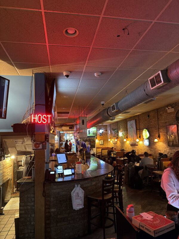 a bar with people sitting at tables