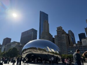 a large reflective object in Millennium Park