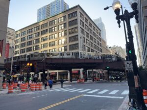 a street with a train over it