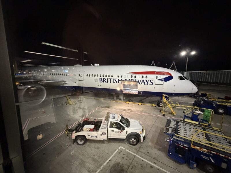 a white airplane parked on a tarmac