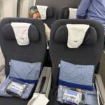 a couple of people sitting in a plane