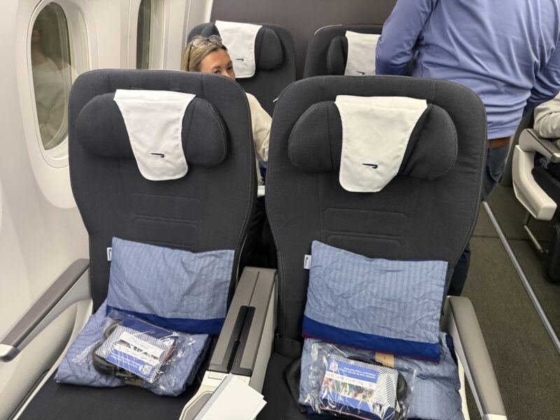 a couple of people sitting in a plane