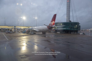 an airplane on a wet runway