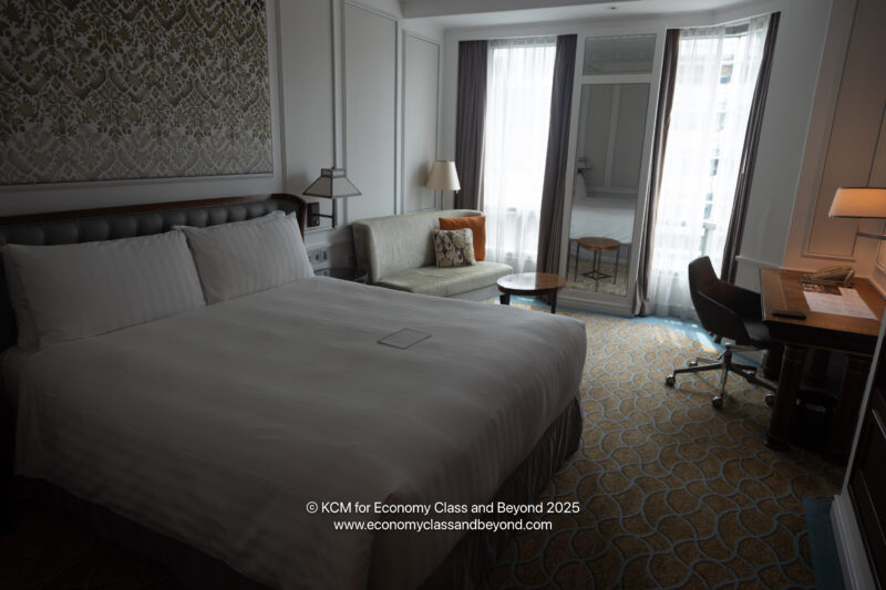 a room with a bed and a chair