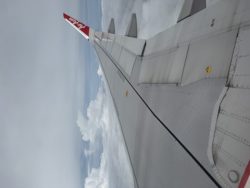 an airplane wing in the sky