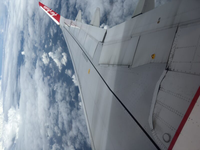 the wing of an airplane above the clouds