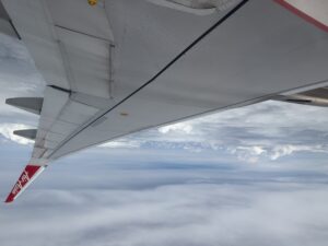 an airplane wing in the sky