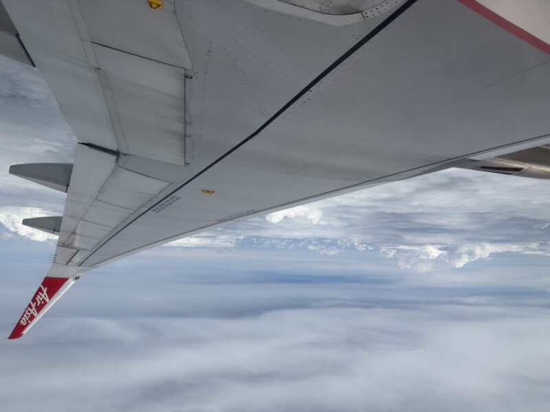 an airplane wing in the sky