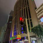 a tall building with a traffic light