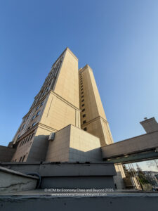 a tall building with a bridge over it