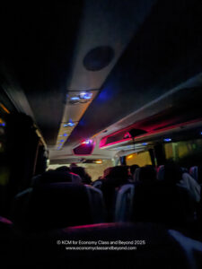 a group of people sitting in a bus