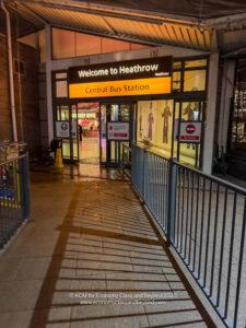 a building with a sign and a railing