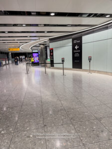 a large airport with people walking around
