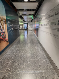 a hallway with a sign on the wall