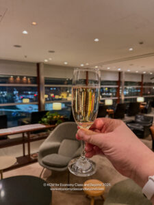 a hand holding a glass of champagne