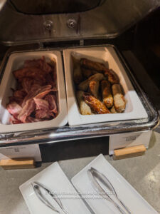 food in a tray with meat and sausages