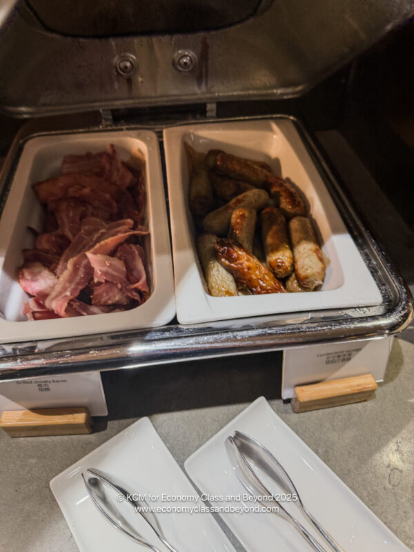 food in a tray with meat and sausages