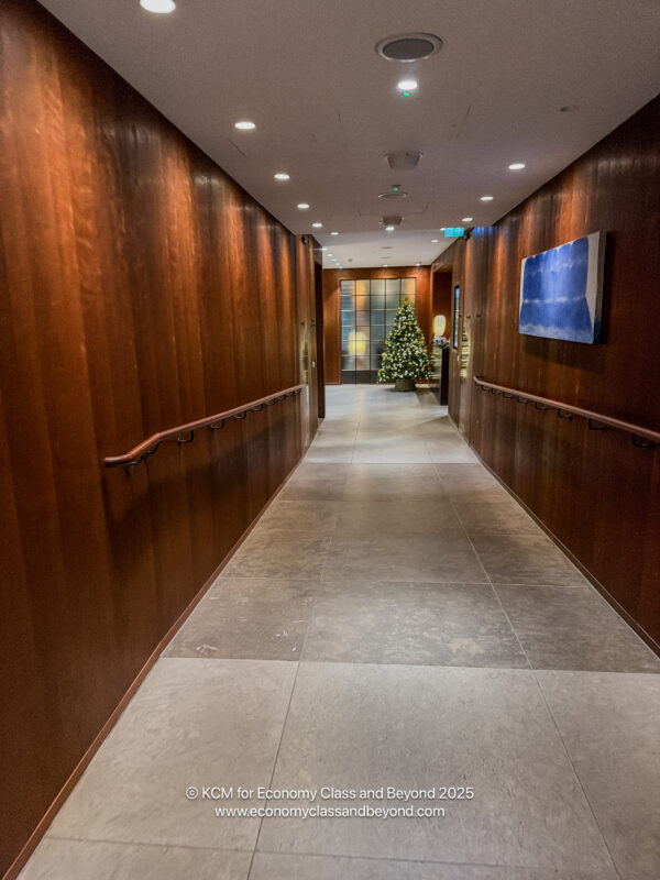 a hallway with a christmas tree