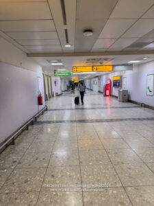 a person walking a dog in a hallway