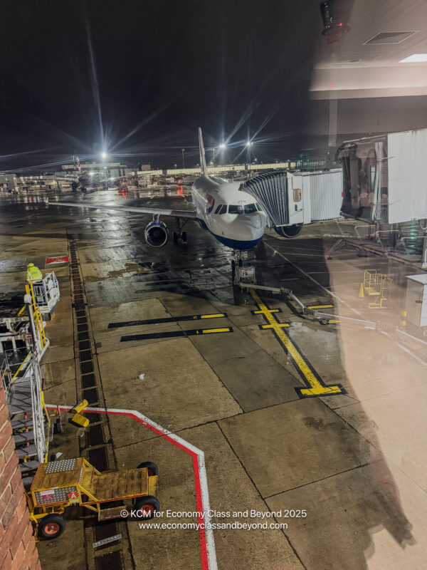 an airplane on the tarmac at night