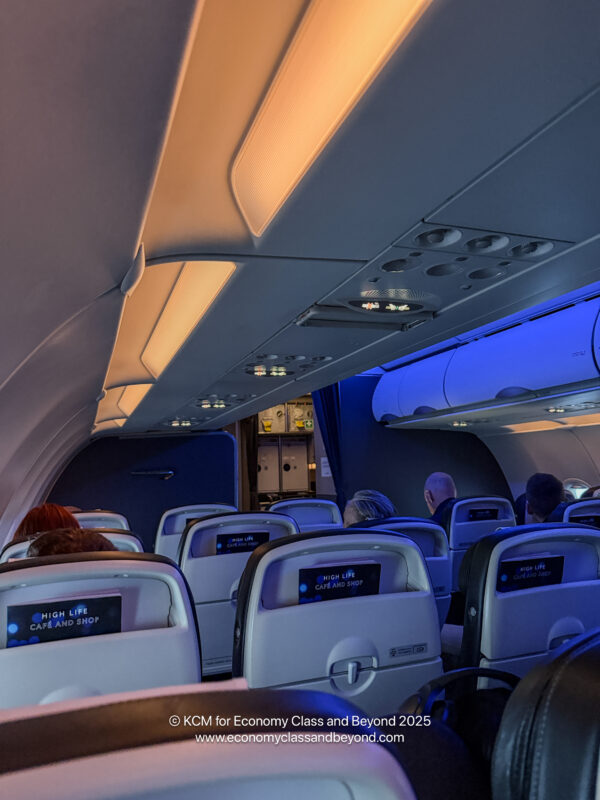 a group of people sitting in an airplane