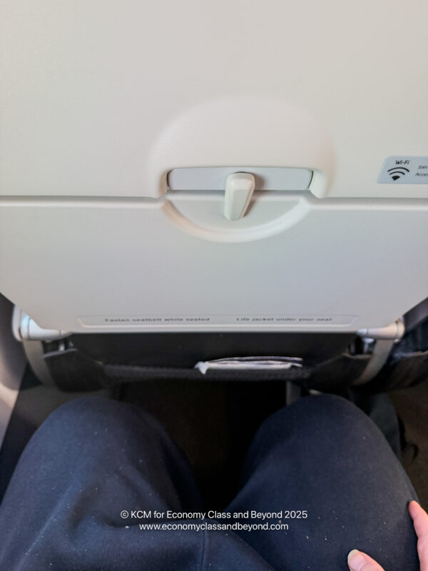 a seat with a button on the side