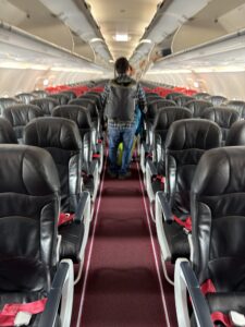 a man walking in an airplane
