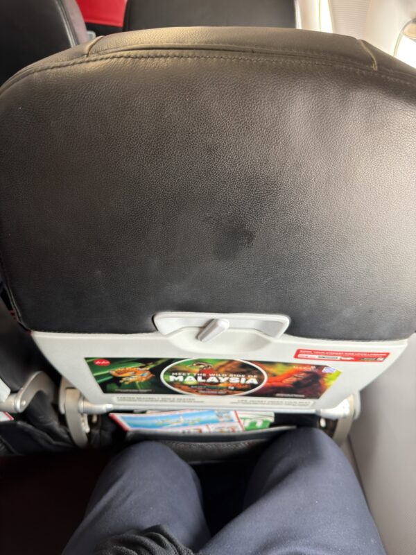 a seat with a magazine on it