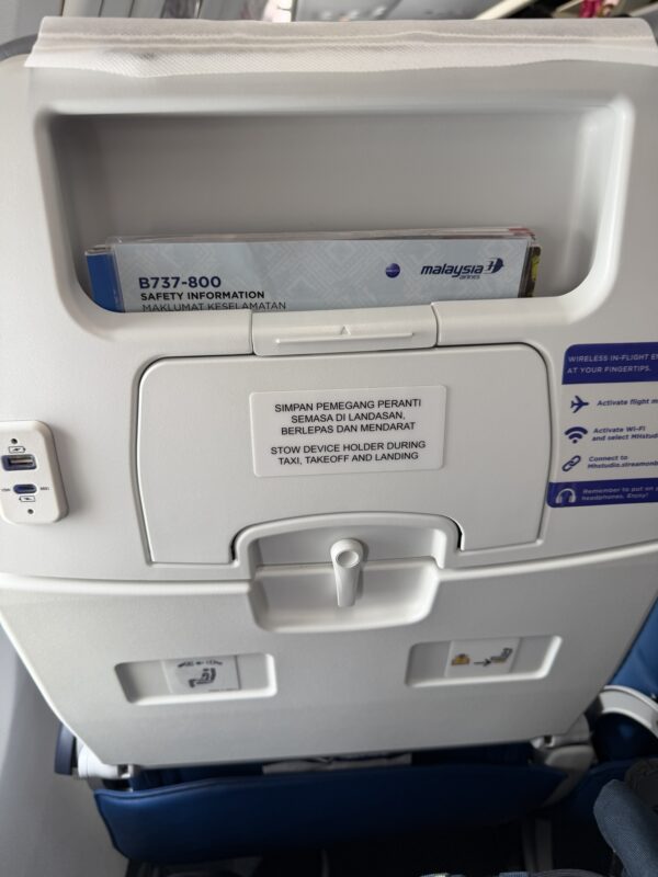 an airplane seat with a safety information