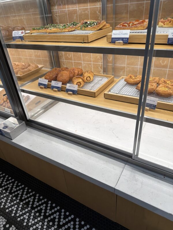 a display case with pastries on it