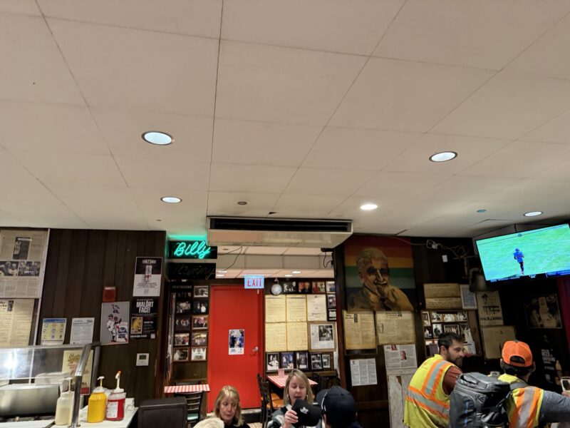a group of people sitting in a restaurant