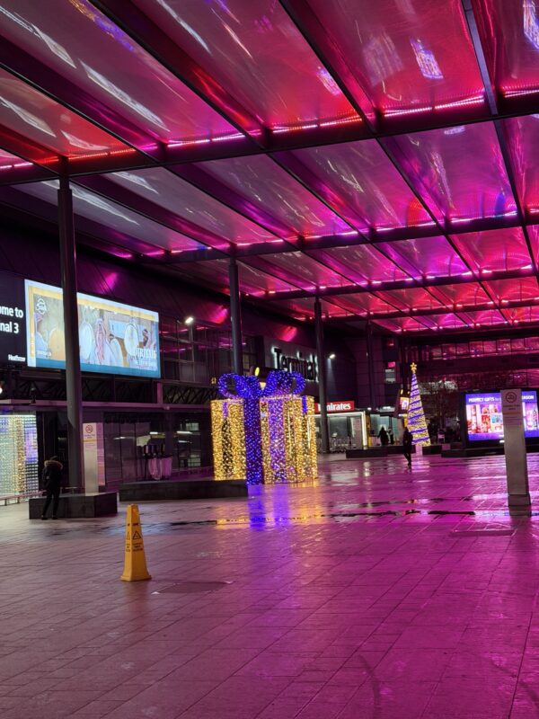 a large building with lights and signs