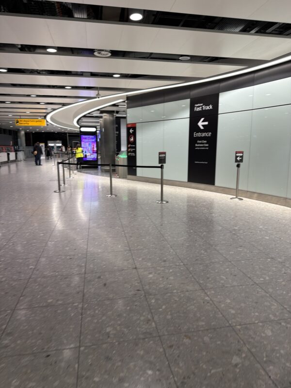 a large airport terminal with people walking around