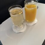 two glasses of liquid on a table