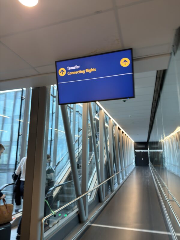a blue sign in a hallway