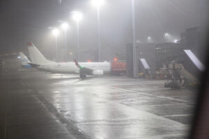 an airplane on a wet runway