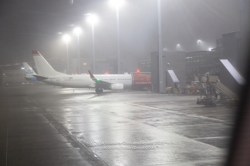 an airplane on a wet runway