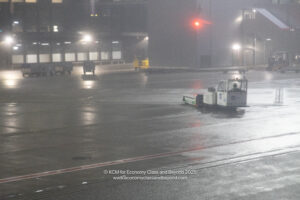 a small vehicle on a wet street