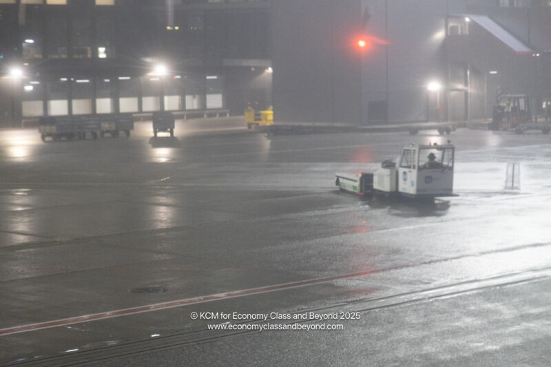a small vehicle on a wet street