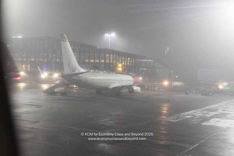 an airplane on a runway at night