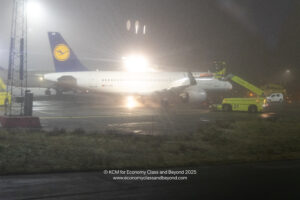 a plane on the runway at night