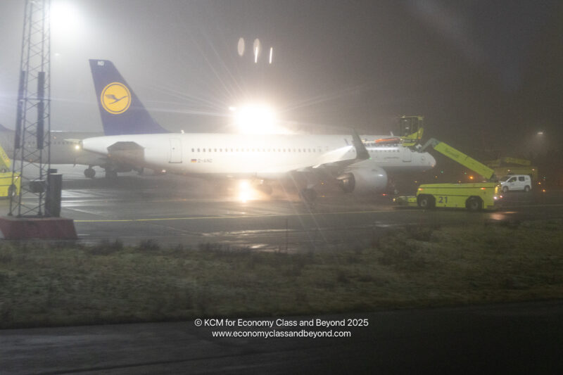 a plane on the runway at night