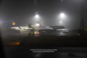 a plane on the runway at night