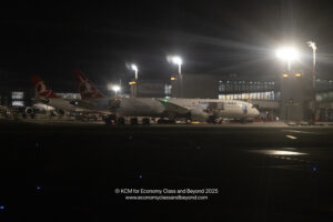 airplanes at an airport at night