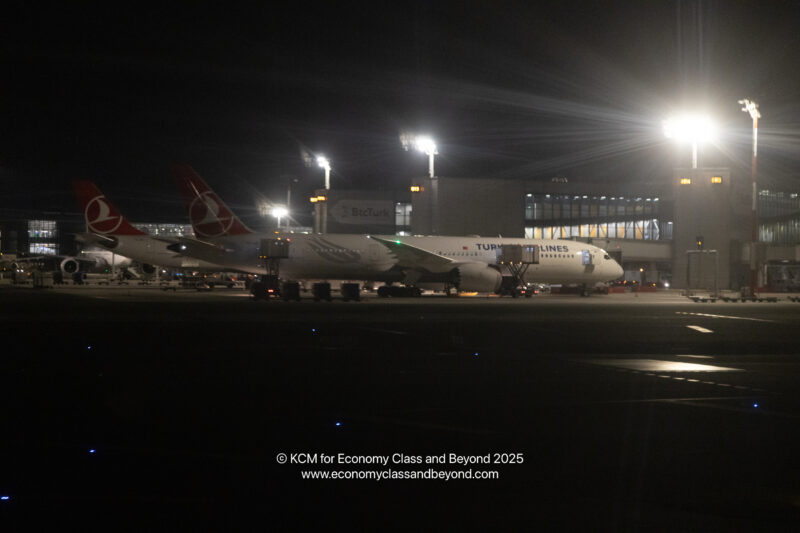 airplanes at an airport at night