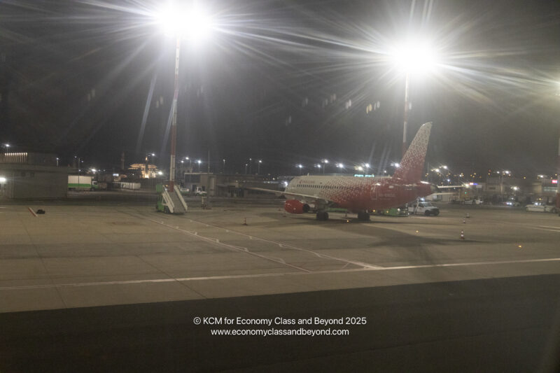 an airplane on a runway at night