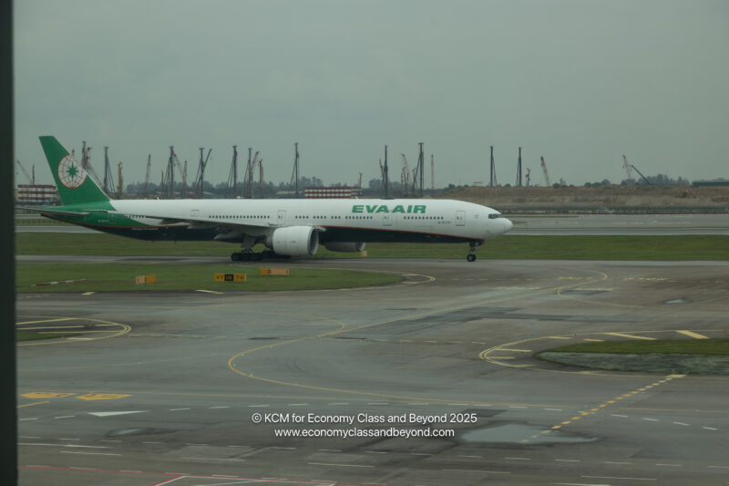 a large white airplane on a runway