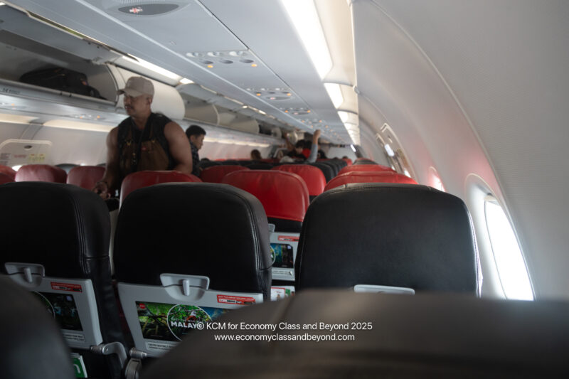 a man standing in an airplane