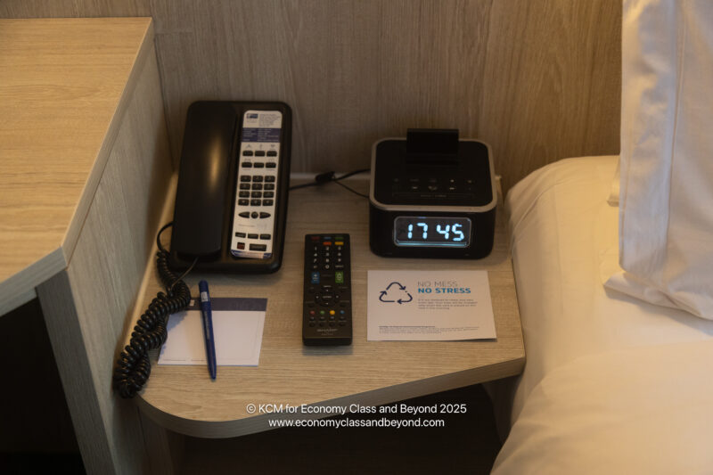 a phone and alarm clock on a table