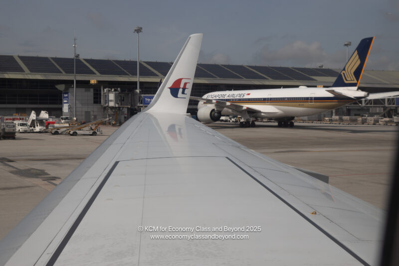 an airplane wing and plane in the air